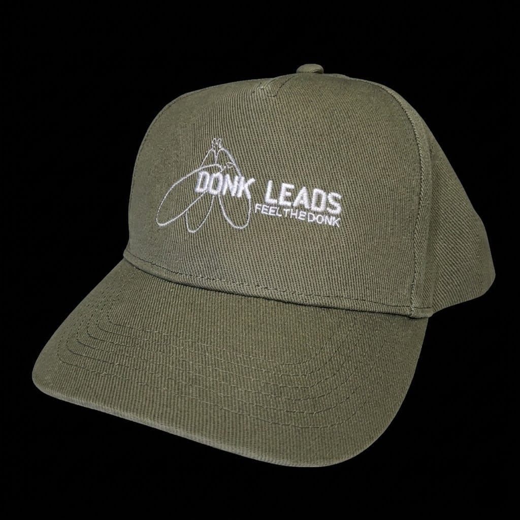 Green cap with 'DONK LEADS' logo on a black background